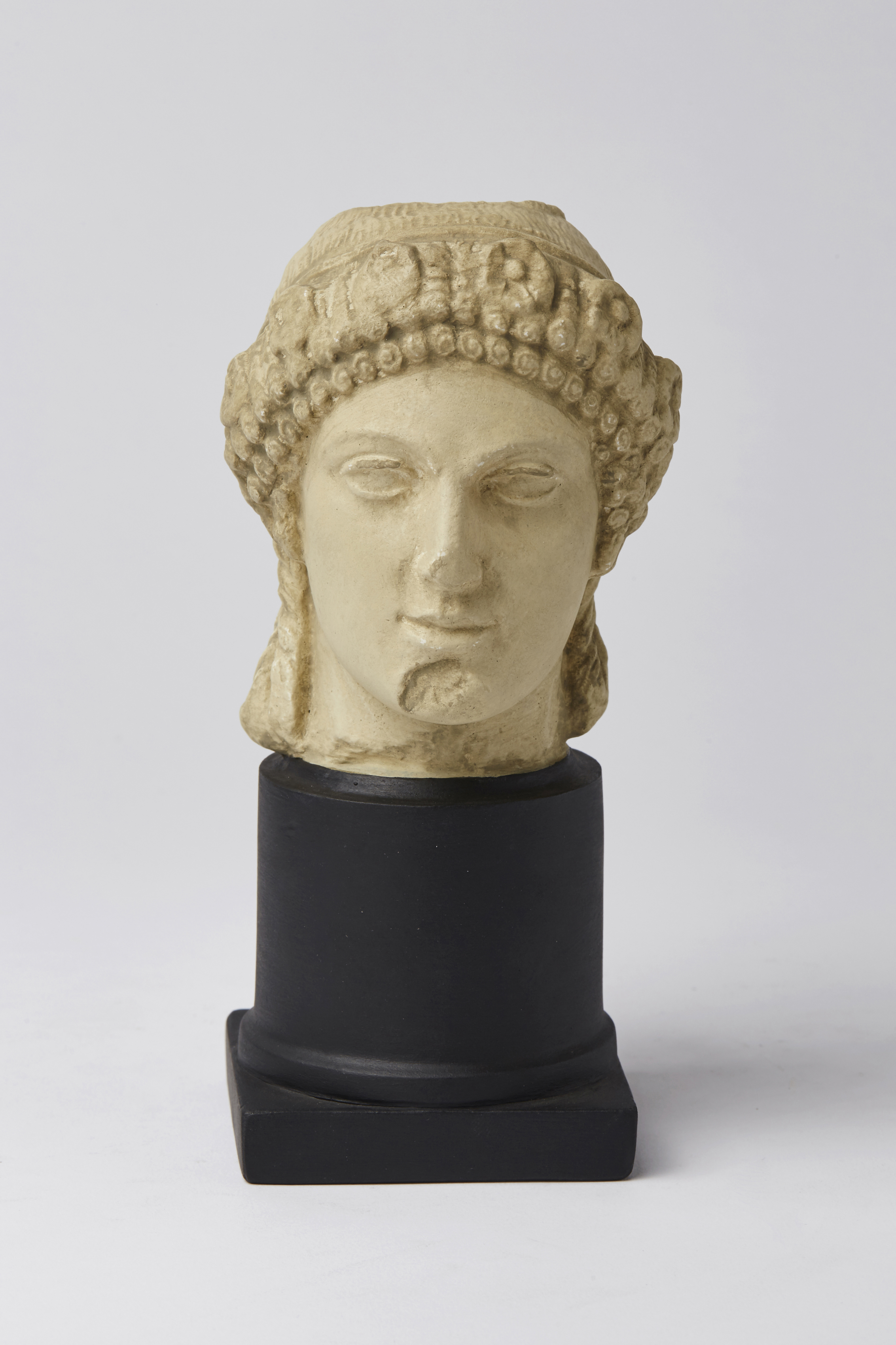 Archaized Head of a Youth wearing a Garland of Flowers on his Head